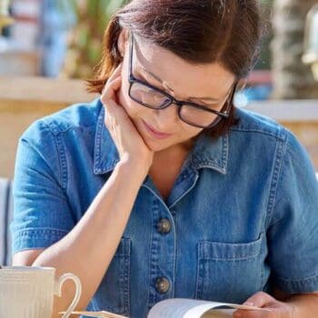 Woman reading a book Menopause Highland Health - Inverness Scotland menopause healthcase clinic